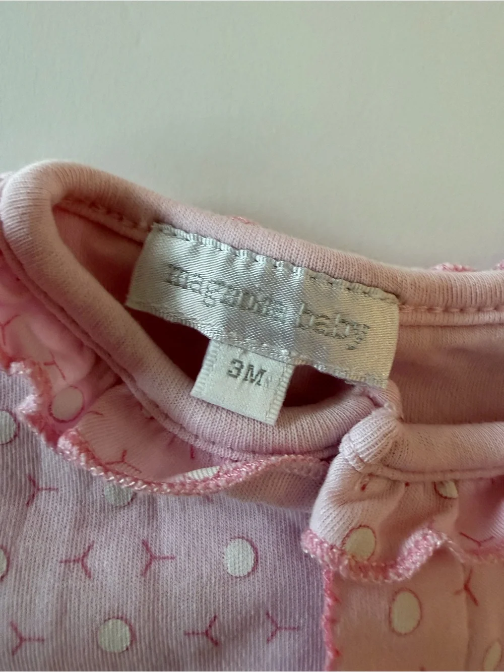 Magnolia baby pink footie with golf cart and golf ball print 3Mo